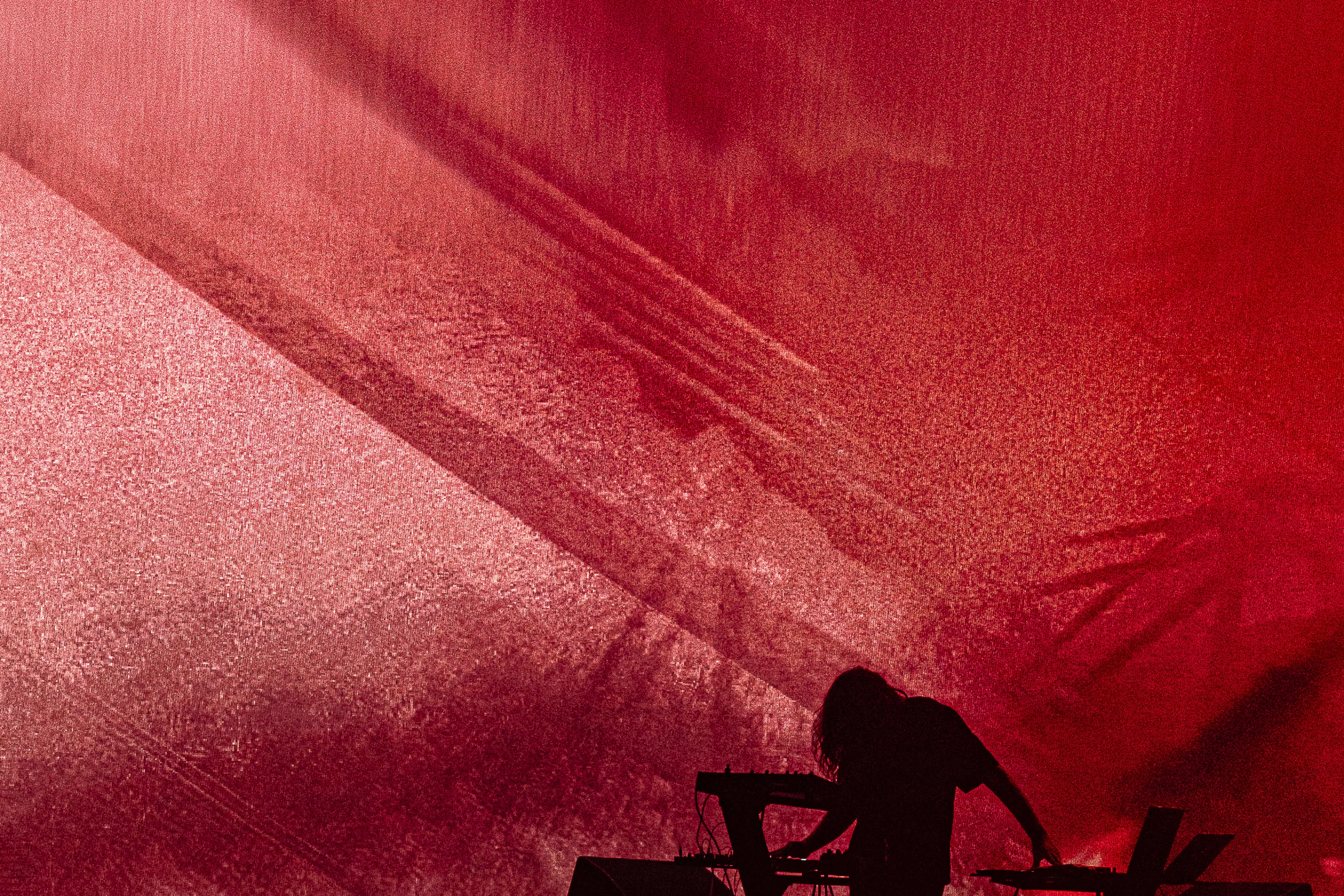 Live concert photography capturing musicians performing on stage with dynamic lighting and energetic crowd engagement.